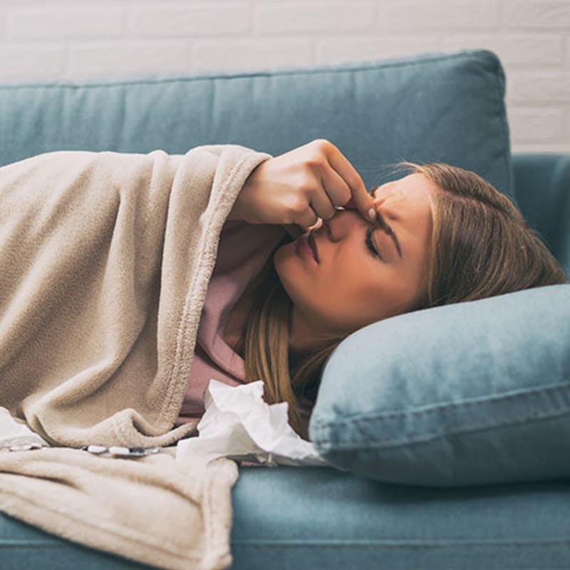 Woman Dealing with Symptoms of Flu